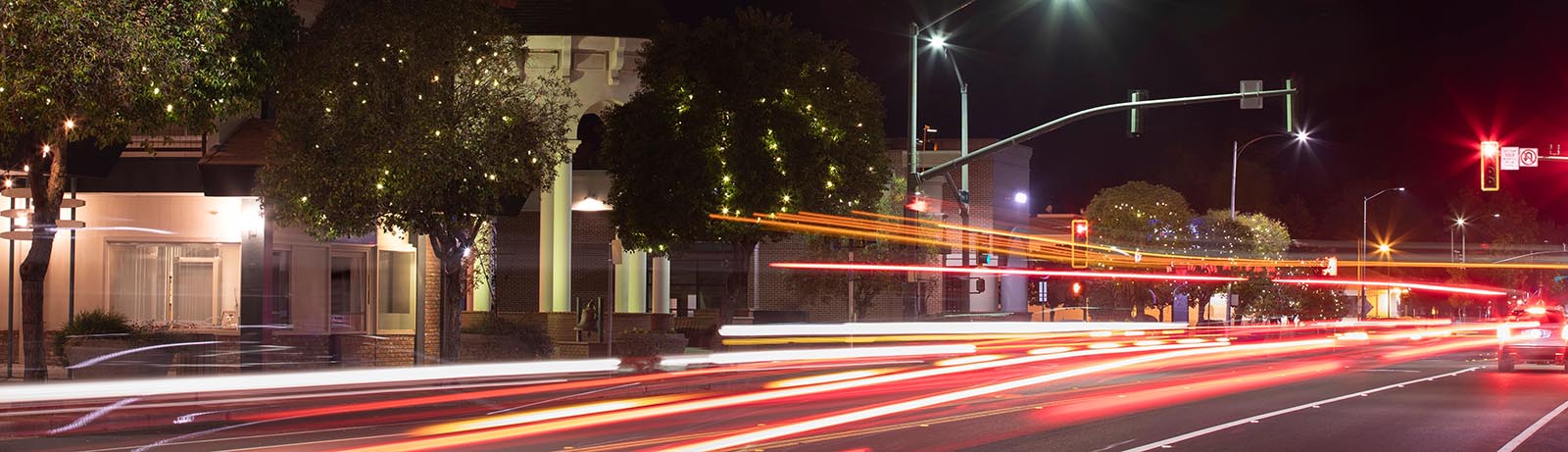 Night time traffic streams through historic downtown Red Bluff, California, USA.